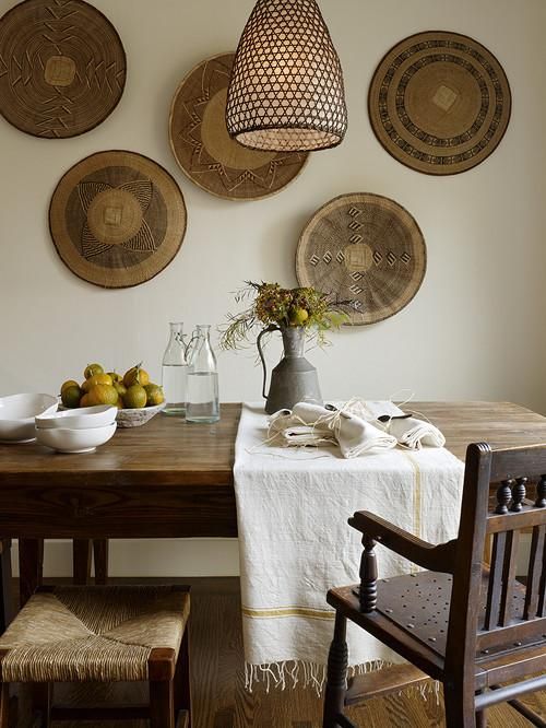 African baskets on the wall of a dining room