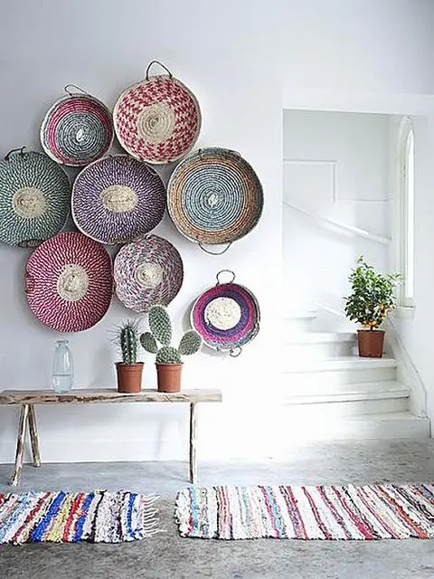 colorful handwoven baskets for decorating a wall