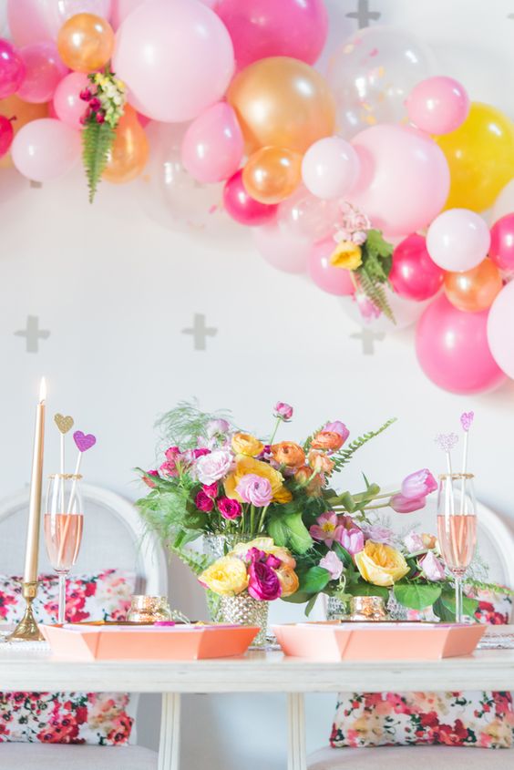 colorful balloon arch over the reception table