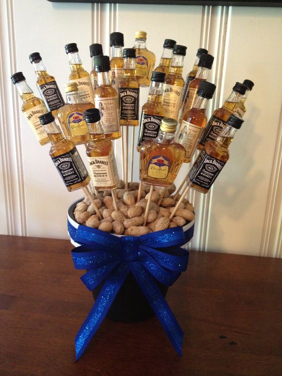 11 man centerpiece with small alcohol bottles
