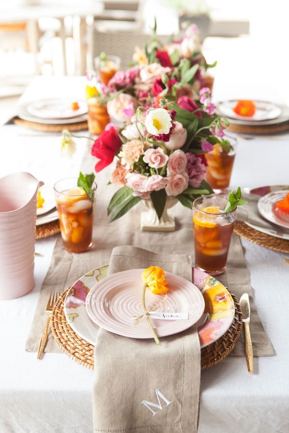 blush and colorful blooms give a color to this table and make it more interesting