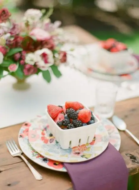 place containers with berries on each place setting as a cute trifle