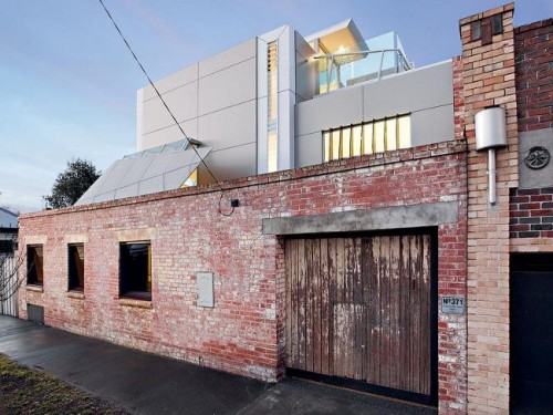 House With Industrial Exterior And Minimalist Interior - Shelterness