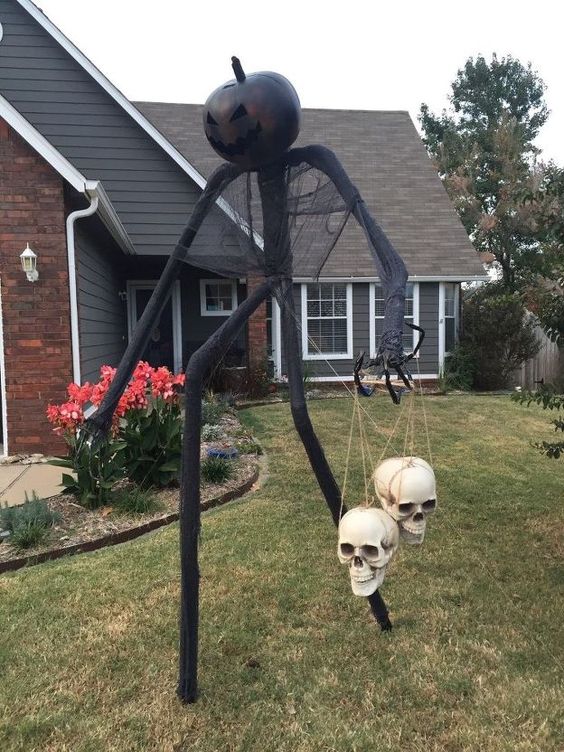 a PVC pipe yard Halloween monster with some skulls is an ultimate idea to scary everyone who comes on visit
