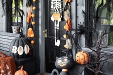 a front door decorated with a skeleton for Halloween
