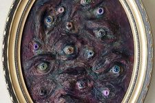 a very creepy eye Halloween art in dark shades is a gorgeous decoration you can DIY for your party