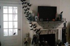 bats coming out of a fireplace and flying all over around are gorgeous scary Halloween decorations