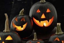 classic black Jack-o-lanterns with candles inside are a timeless decor idea for Halloween