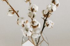 a geometric vase with cotton branches is a cool fall arrangement or centerpiece with a modern twist