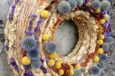 a woven fall wreath with allium, billy balls, lavender and dried blooms is a cool decoration to rock