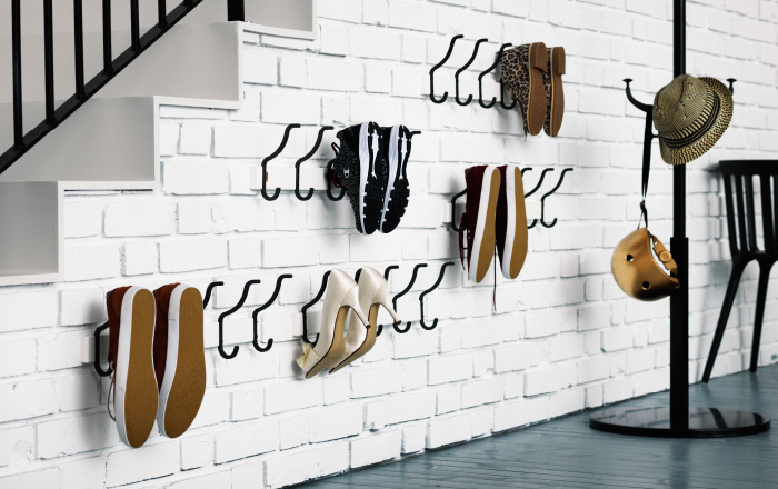 clever use of IKEA hooks to occupy wall space for shoe storage