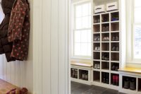 styilish entryway shoe storage under benches and in a tall cabinet