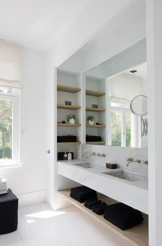 a contemporary bathroom with a large niche, with a double sink and niche shelves inside is a cool idea