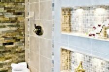 a stylish and cozy bathroom with various types of tiles and niche shelves with additional light to store shampoos, balms and various other stuff