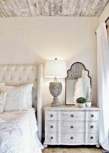 french country bedroom desigh with lots of whitewashed surfaces