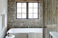 natural materials works really well in this modern french country bathroom