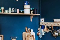 blue backsplash is perfect to highgligh wood shelves on wood brackets