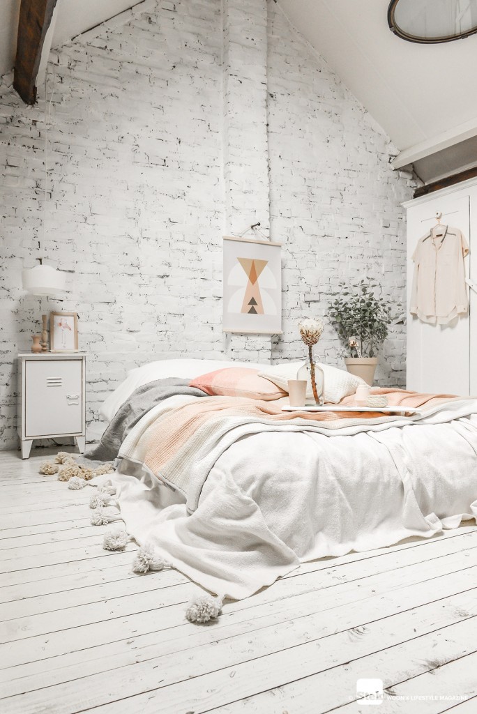 attic bedroom design with whitewashed brick wall