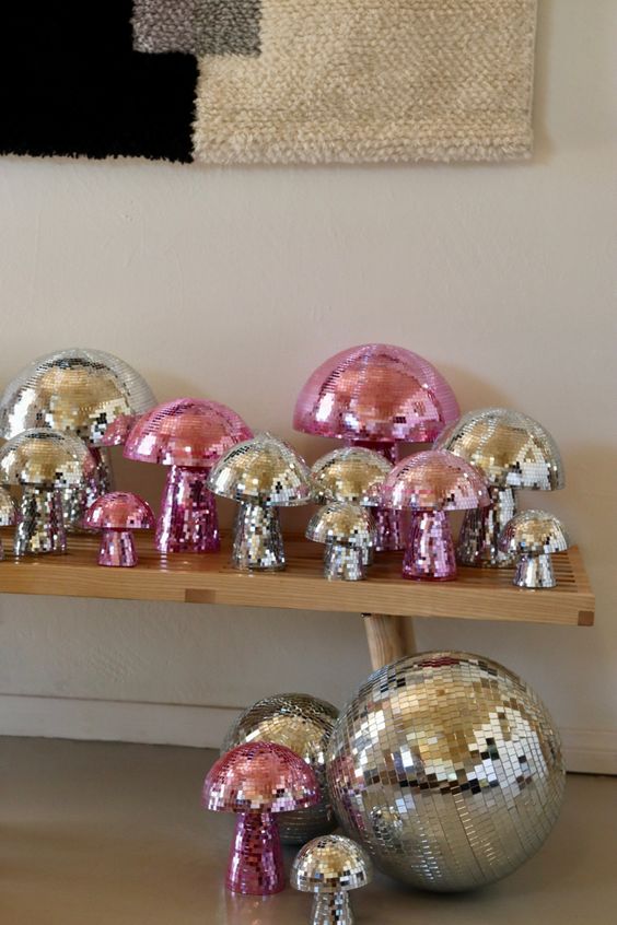 silver and pink disco mushrooms and a ball are a super fun and cool decor idea for any dopamine-infused home