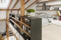 stylish attic bedroom design with lots of book storage