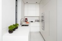 All white is a way to go for a narrow kitchen