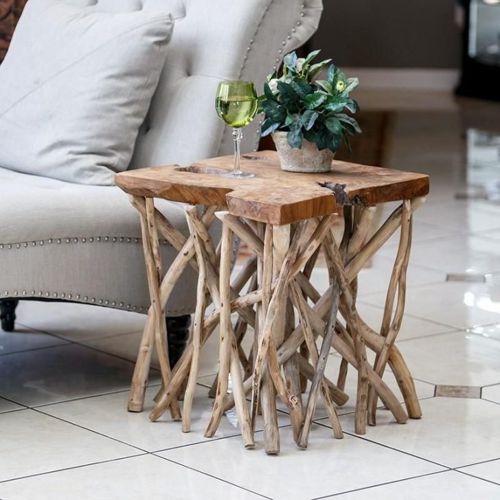 a cute side table made of branches as legs and a slice of wood for the tabletop is a very natural idea