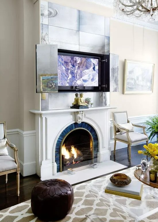a fireplace and an artwork over it that hides a TV - open the doors and you will get your TV