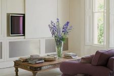 a cute neutral living room design with a hidden TV