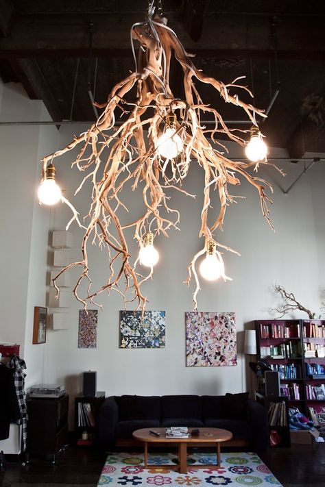 a statement chandelier made of gorgeous tree branches and bulbs is a fantastic feature for your home