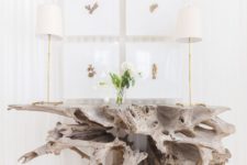 a whimsy console table of driftwood is a perfect statement piece for your beach home entryway