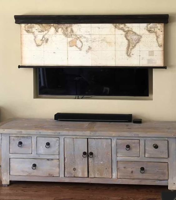 a world map stylishly covering the TV is a lovely solution for many spaces, for keen travelers and for kids, too