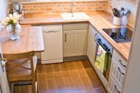faux painted brick looks well on a small kitchen
