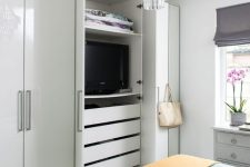 hide your TV inside your wardrobe, when not in need, it will be covered with doors, and when you want to watch it, you will open them