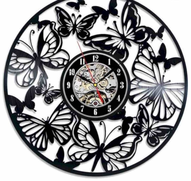 a black laser cut butterfly wall clock is a bold idea yet in a classic monochromatic color scheme