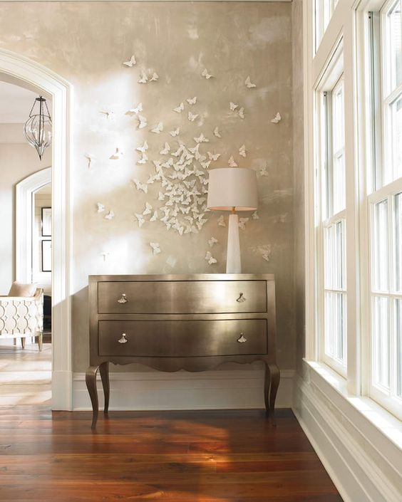 a refined shiny dresser and a 3D white butterfly circle that accents it and catches an eye