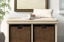 a storage bench with wicker cubbies and upholstery and a neutral pillow is ideal for an entryway