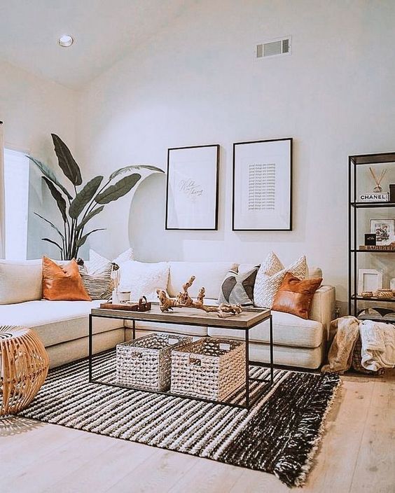 a welcoming boho living room with a coffee table and wicker cubbies under it for storage
