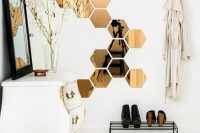 honeycomb mirrors are practical and looks beautiful in this scandinavian-like hallway