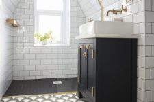 a monochromatic art deco attic bathroom with white and black tiles, a catchy printed floor, touches of gold for more chic