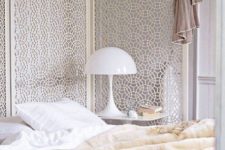 a beautiful white laser cut screen as a headboard looks ethereal and very chic, perfect for a feminine bedroom
