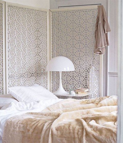 a beautiful white laser cut screen as a headboard looks ethereal and very chic, perfect for a feminine bedroom