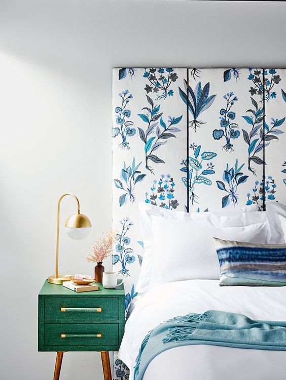 a blue and white floral printed screen is a cool idea for a modern light-filled bedroom,it brings color and pattern to the space