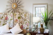 a bright floral printed headboard brings a cool feel to the space and makes it brighter and catchier