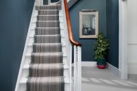 a chevron-patterned wool stair runner is a great addition to a contemporary staircase