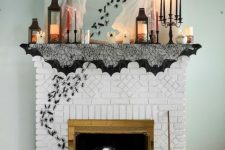 candle lanterns, colorful candles, spiderwebs, bugs going from the fireplace up and a broom