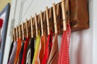 scarves could be hanged on a diy wood plank with clothspins