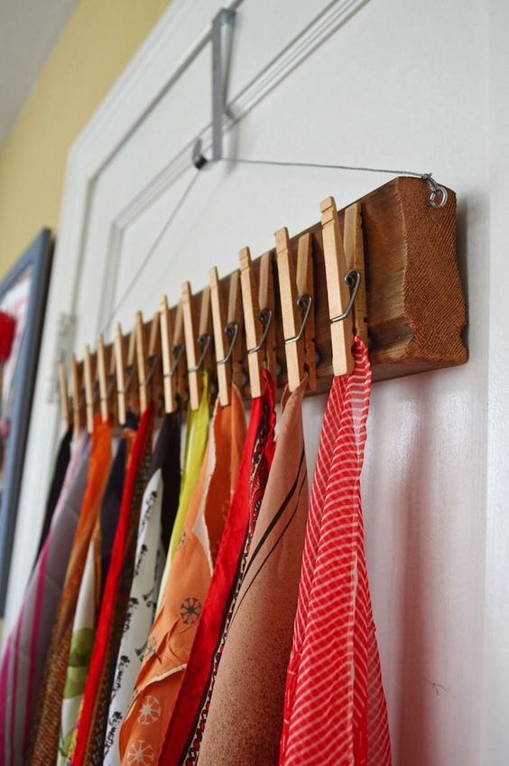 scarves could be hanged on a diy wood plank with clothspins