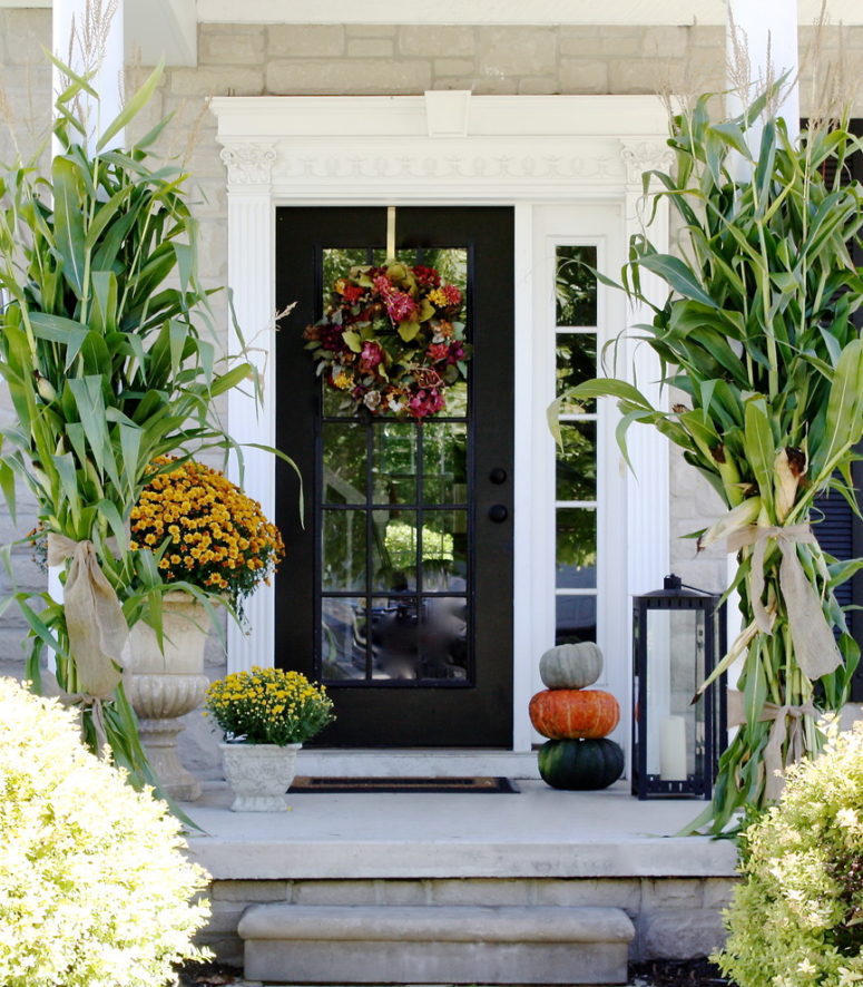 Oversized mums, pumpkins, lanterns and cornstalks would be a great addition to a fall wreath.