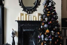 a black Halloween tree with skulls, spiders, webs, pumpkins, colorful ornaments is a stylish and moody decoration