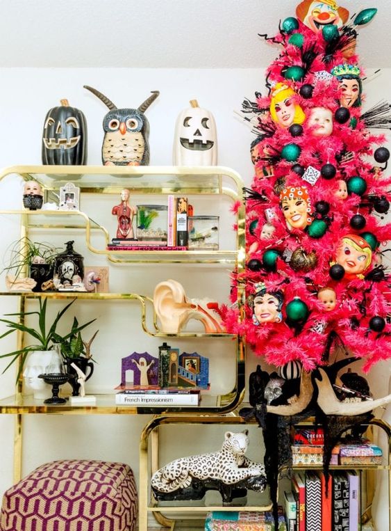 a pink Halloween tree with colorful ornaments and scary masks for a bold interior